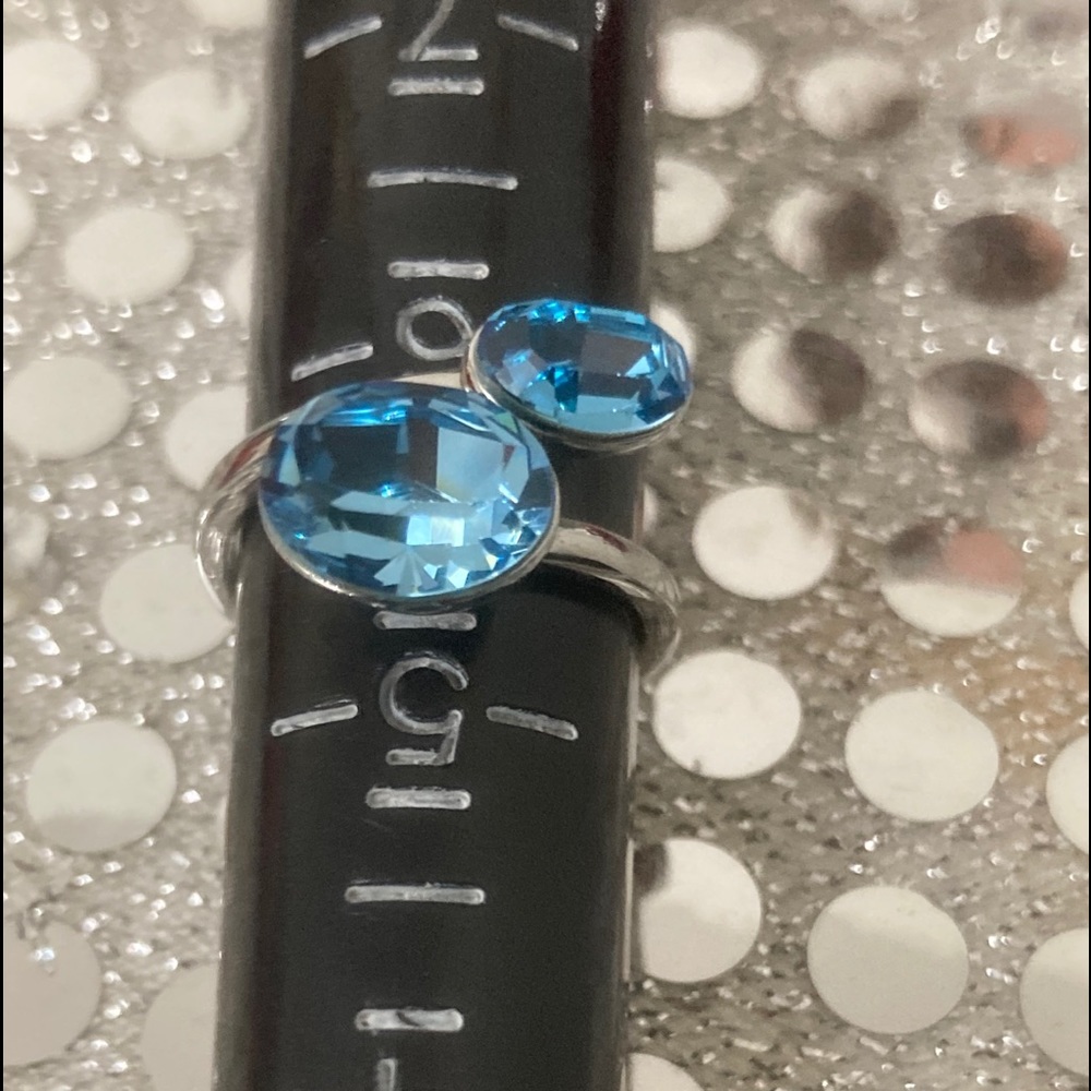 Stainless steel, bypass-style ring Bezel-set oval
